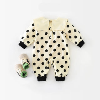 Baby romper with black polka dots on a white background, featuring the brand 'ABNN baby'.